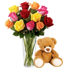 12 Multi color roses in vase with small teddy bear to manila
