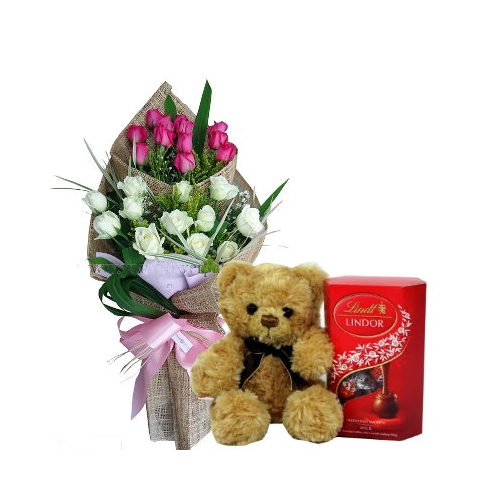 white and pink roses with bear and chocolate