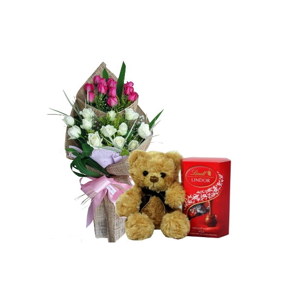 white and pink roses with bear and chocolate